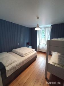a bedroom with a bed and a window at A 2 pas du lac in Xonrupt-Longemer
