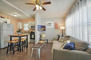 a kitchen and living room with a couch and a table at Steps to Beach & Downtown! Cozy Beach Bungalow #3 in Lake Worth