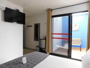 Ένα ή περισσότερα κρεβάτια σε δωμάτιο στο Hotel Acqua Medellín