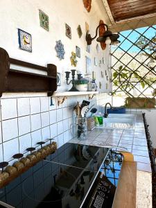 a kitchen with a sink and a counter top at Casa Lunastella Locazione Turistica in Mondello