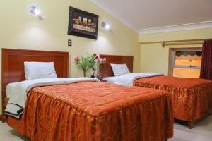 Postel nebo postele na pokoji v ubytování Hotel Elmer-Z + 7 fotografií