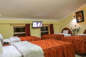 Postel nebo postele na pokoji v ubytování Hotel Elmer-Z