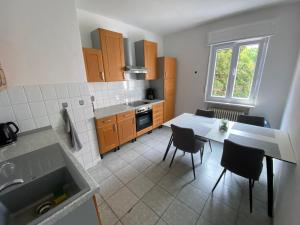 Kuchyň nebo kuchyňský kout v ubytování Swan Rooms + 37 fotografií