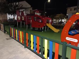 a playground with a train on top of a fence at Corazón de Andalucía in Antequera