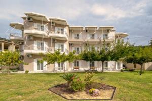 a large apartment building with a yard at Staikos in Ligia +38 photos