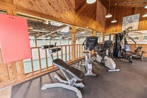 a gym with several treadmills and exercise bikes at Mountainside at Stowe in Stowe