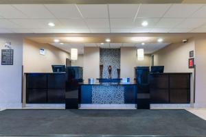 a lobby with a counter in a building at Best Western Plus South Edmonton Inn & Suites in Edmonton