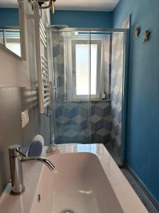 a bathroom with a sink and a shower at Da Claudio e Ivana in Camerano