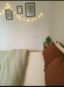 a living room with a couch and lights on the wall at Evaggelia's Apartments 3 Διαμονή στο χωριό 