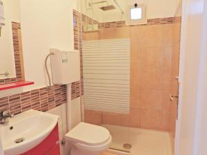 a bathroom with a toilet and a sink at B&B Il Paradiso di Capri in Anacapri