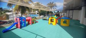 a play area with a playground with a slide at Lindo Apartamento Moderno e Reformado na Barra in Rio de Janeiro