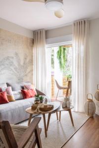 a living room with a couch and a table at Costa De Madrid-San Martin de Valdeiglecias in San Martín de Valdeiglesias
