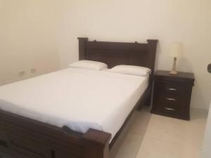 Giường trong phòng chung tại Hermoso Apartamento Bien Ubicado