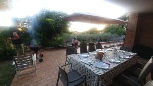 a man taking a picture of a table on a patio at La Casa delle Ciliegie in Assisi +36 photos