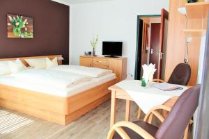Postel nebo postele na pokoji v ubytování Chalet Swiss - Appartementhotel + 35 fotografií