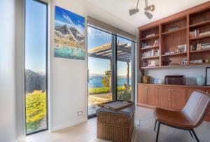 a home office with a view of the mountains at Lake Pukaki Lake House in Lake Pukaki