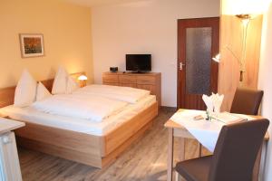 Postel nebo postele na pokoji v ubytování Chalet Swiss - Appartementhotel