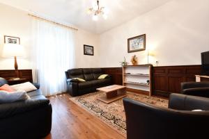 a living room with a couch and a table at Etchevers-enia in Suhescun