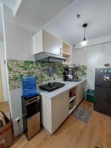 Η κουζίνα ή μικρή κουζίνα στο 7th floor Seawind Condo 2br unit near Davao Airport +10 φωτογραφίες