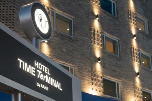 a clock on top of a sign in front of a building at Hotel TimeTerminal by Annk in Daejeon