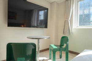 TV in/ali zabaviščno središče v nastanitvi TimeTerminal Hotel Daejeon 1st by Aank