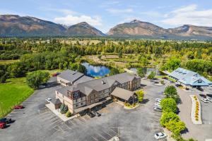 an aerial view of a building with a parking lot at Bitterroot River Inn and Conference Center in Hamilton