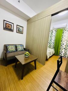 a living room with a couch and a table at 1bedroom With Balcony Taguig Near Bgc mc kinley in Manila
