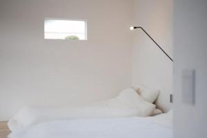 Postel nebo postele na pokoji v ubytování 駅舎ホテル INN MY LIFE