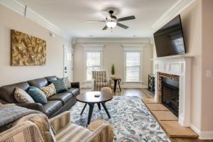 a living room with a couch and a fireplace at Charming Alabama Retreat with Patio and Pool Access! in Owens Cross Roads