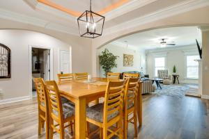 a dining room and living room with a wooden table and chairs at Charming Alabama Retreat with Patio and Pool Access! in Owens Cross Roads