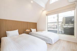 Postel nebo postele na pokoji v ubytování Hotel STAY ARI Higashishinjuku