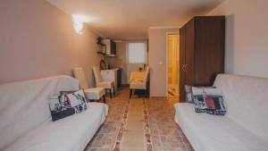 a living room with two beds and a dining room at Apartments with a parking space Sabljak Selo, Gorski kotar - 21683 in Ogulin