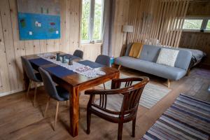 a living room with a table and chairs and a couch at Apartments with parking space Plaski, Velebit - 21935 in Plaški