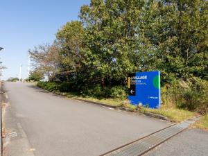 a sign on the side of a road at Minshuku Hirono in Ōyauchi +47 photos