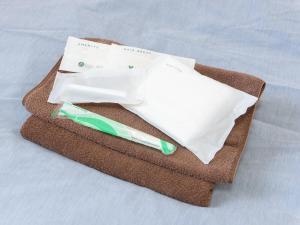 a pair of scissors sitting on top of a towel at Minshuku Hirono in Ōyauchi