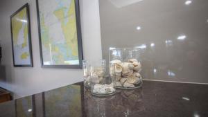 a glass vase filled with rocks on a table at Waterfront on Osprey in Coffin Bay