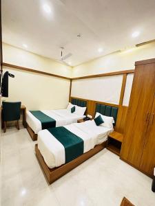 Postel nebo postele na pokoji v ubytování HOTEL BKC DOWNTOWN - NEAR US EMBASSY