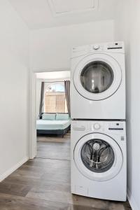 a white washer and dryer in a room at Modern loft close to Universal studio and Hollywood for 8 in Los Angeles