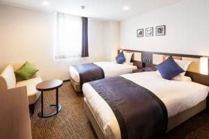 Letto o letti in una camera di HOTEL MYSTAYS Kanazawa Castle