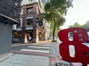 a red object is sitting on the side of a street at 盤古捷旅 - Panco Hotel in Taipei