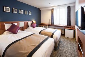 Letto o letti in una camera di HOTEL MYSTAYS Kanazawa Castle