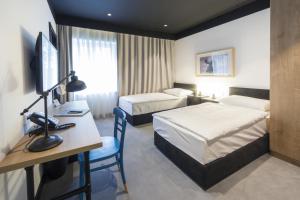 Voodi või voodid majutusasutuse The Loop Hotel toas