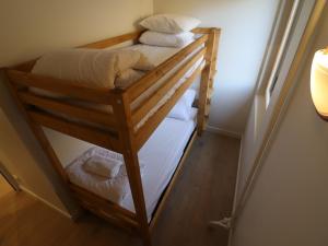 a couple of bunk beds in a room at Appartement lumineux skis aux pieds avec balcon - FR-1-502-541 in Tignes