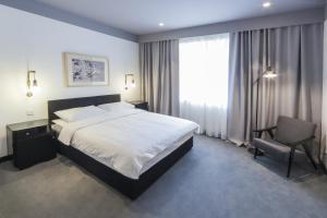 Voodi või voodid majutusasutuse The Loop Hotel toas