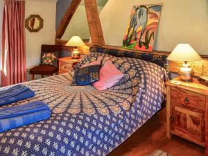En eller flere senger på et rom på Squire Cottage - Uk45665