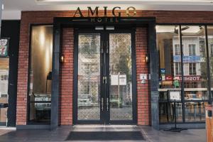 an entrance to a hotel with a glass door at Amigo Hotel in Miri