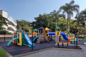 a playground in a park with a slide at Refinado Apartamento na Barra in Rio de Janeiro