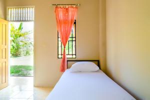 Ένα ή περισσότερα κρεβάτια σε δωμάτιο στο OYO Life 2745 Nabeza House