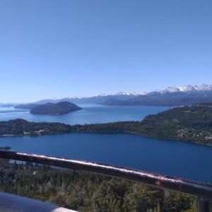 a view of a body of water from a balcony at Ruca Leiva in San Carlos de Bariloche