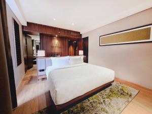 Voodi või voodid majutusasutuse The Balcone Suites & Resort toas